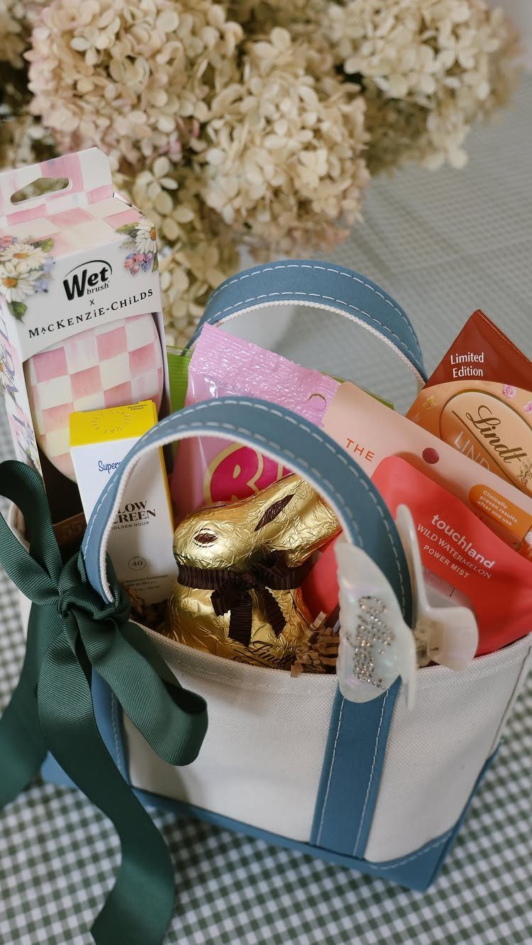 Canvas gift basket filled with chocolate bunny, sweets, and beauty products with green ribbon.