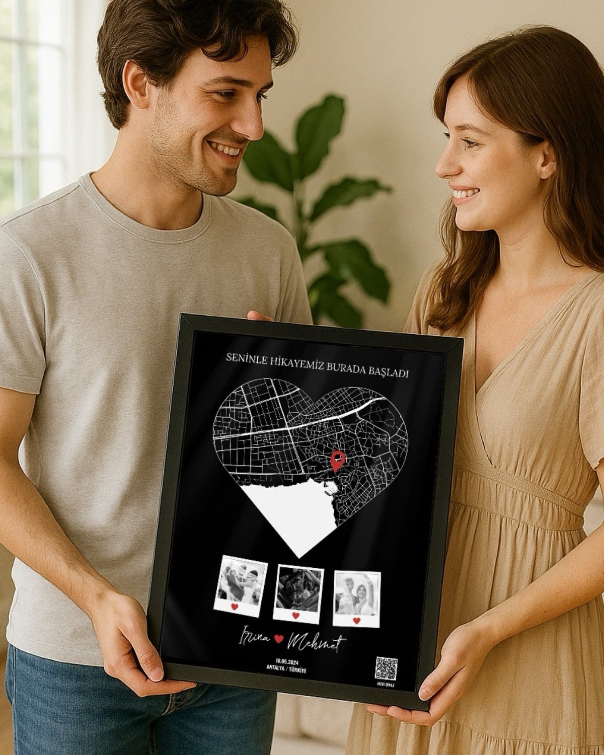 17 Anniversary Boyfriend Gifts He'll Actually Use (2026) 5 Couple holding a framed heart-shaped custom map canvas with photos and text.