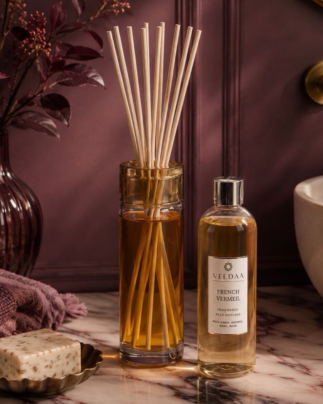 8 Bathroom Gift Ideas for Spa Nights and Everyday Use 2 Reed diffuser bottle with wooden sticks and fragrance oil on marble surface