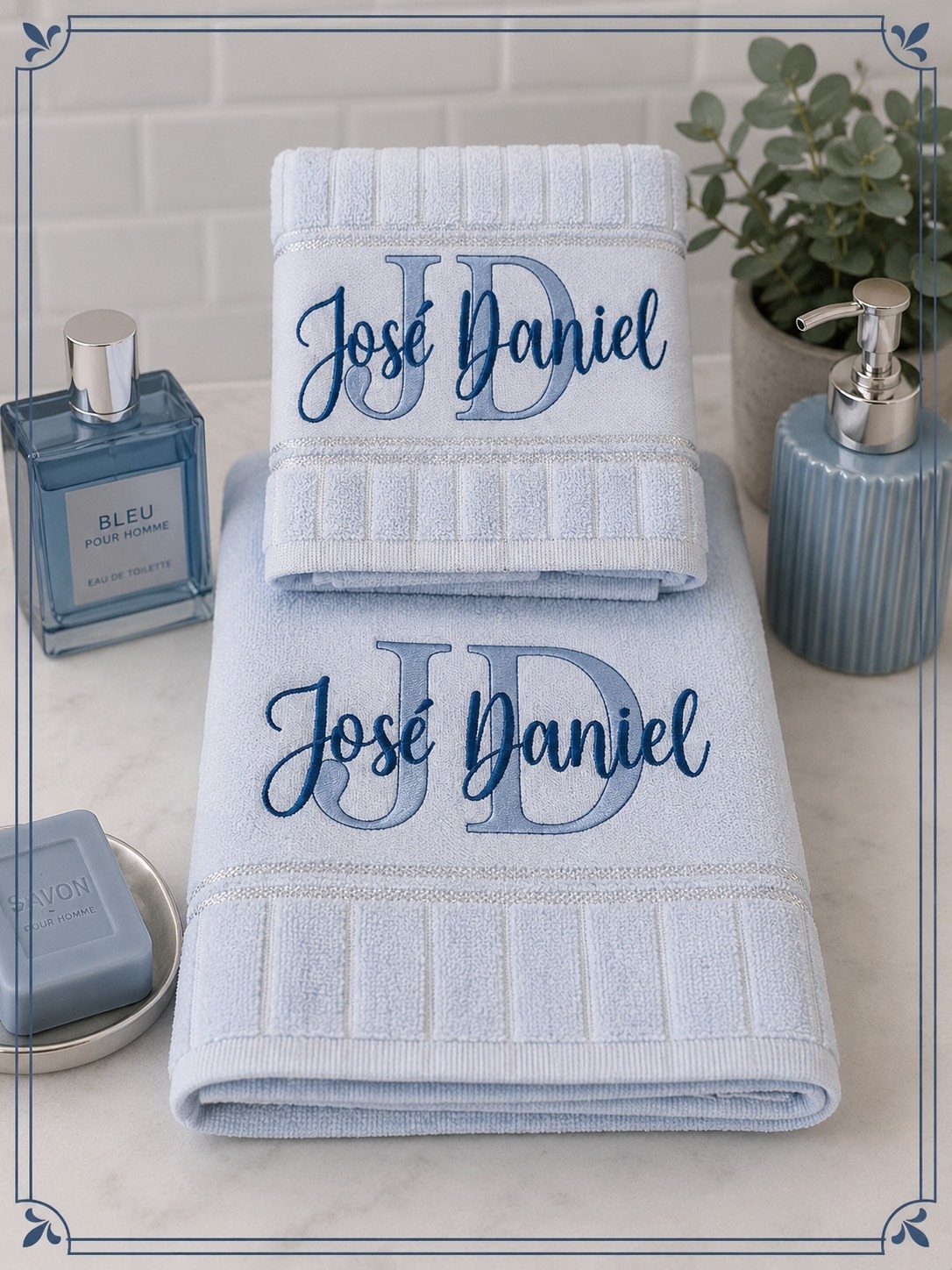 8 Bathroom Gift Ideas for Spa Nights and Everyday Use 3 Light blue embroidered towels with the name José Daniel on a marble counter