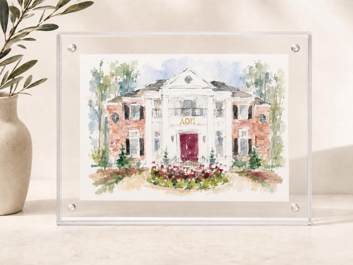 Acrylic picture frame holding a watercolor painting of a Greek sorority house.