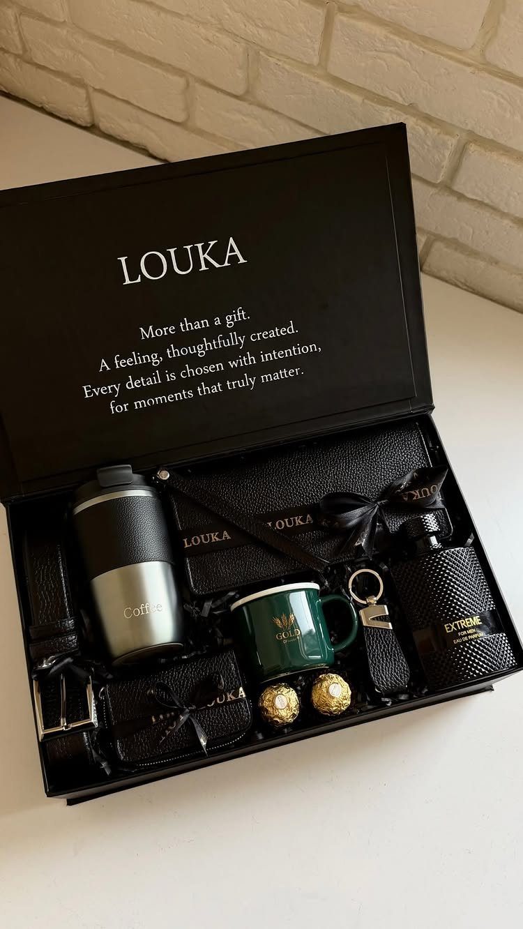 13 Ideas for a Birthday Gift for a Man Who Has Everything 10 Black gift box filled with luxury men's accessories including a thermos and cufflinks.