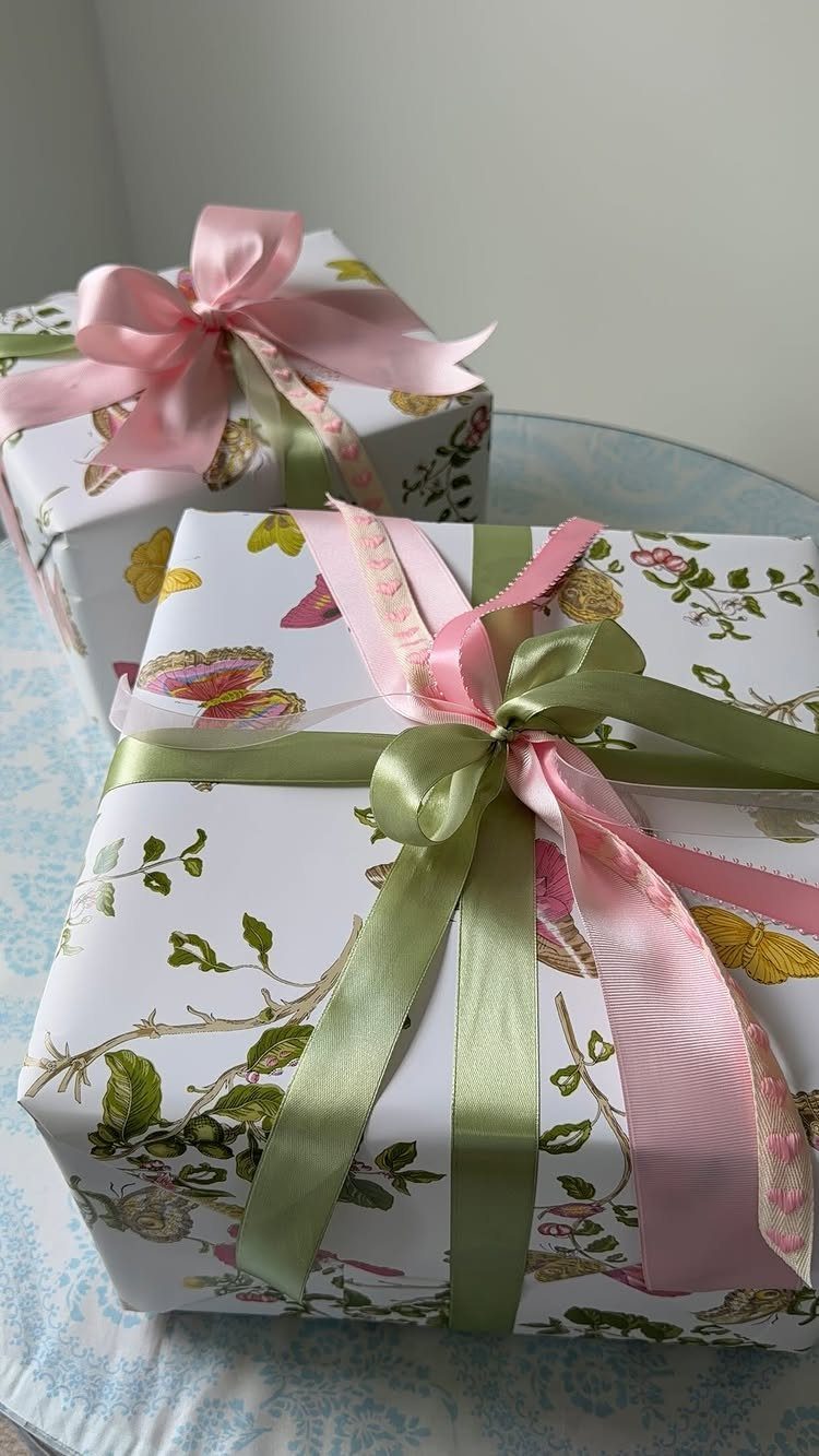Birthday Gift Wrapping Ideas: 9 Ways to Wrap a Present 1 Two floral wrapped gifts tied with pink and olive green satin ribbons.