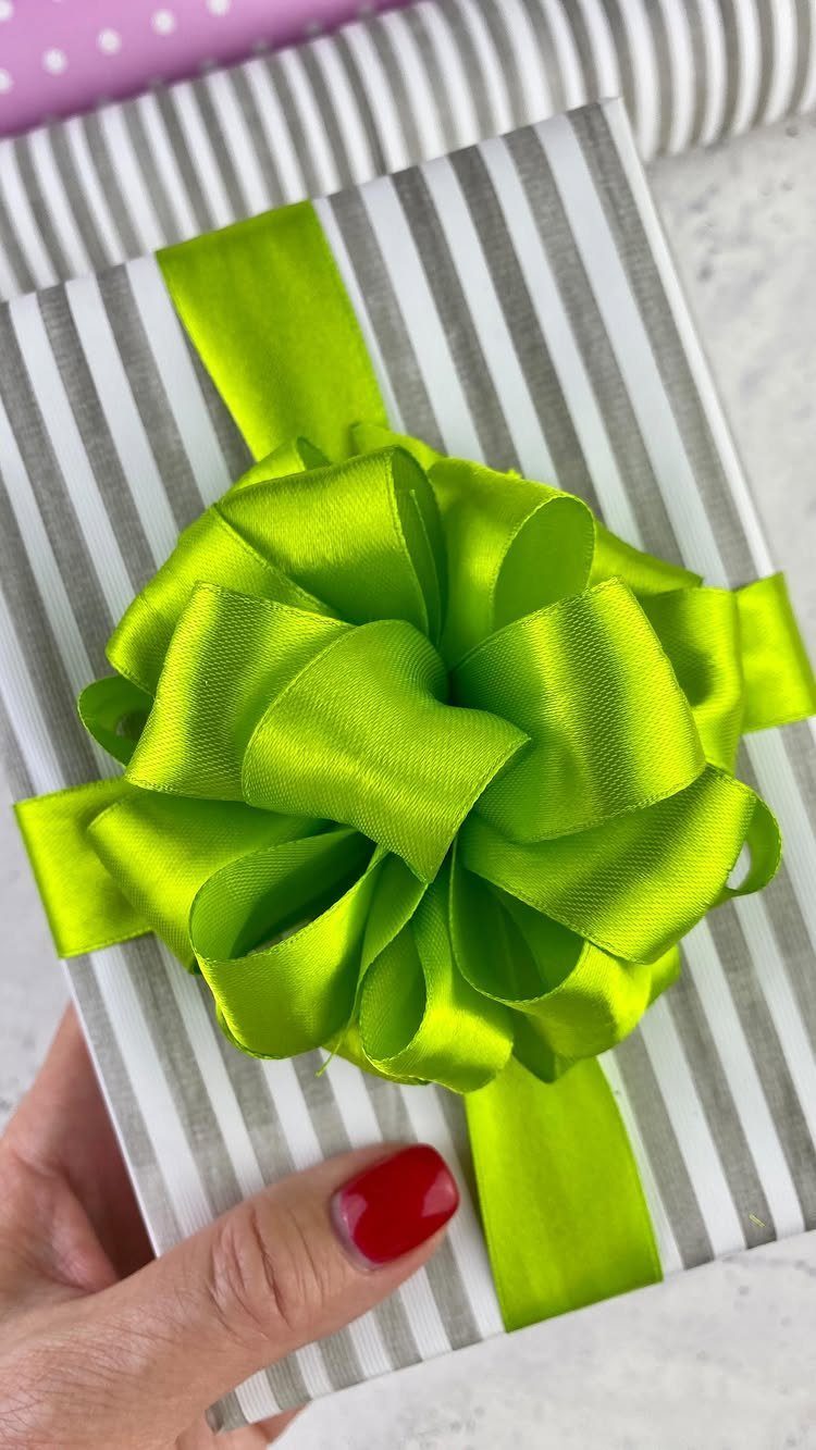 Birthday Gift Wrapping Ideas: 9 Ways to Wrap a Present 5 Gift wrapped in grey and white stripes with a large lime green bow.