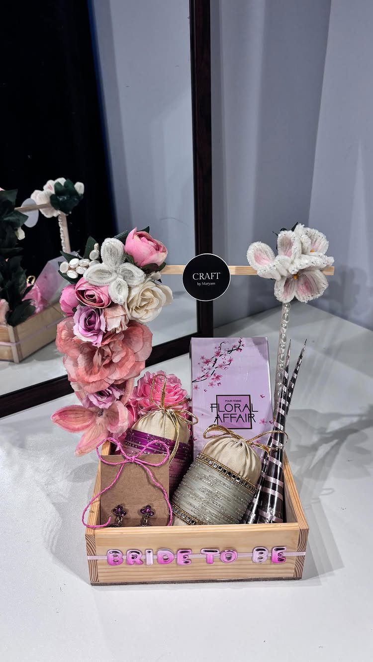 11 Bridal Shower Gift Basket Ideas for Every Bride-to-Be 7 Wooden gift crate with craft supplies and flowers, labeled Bride to Be.