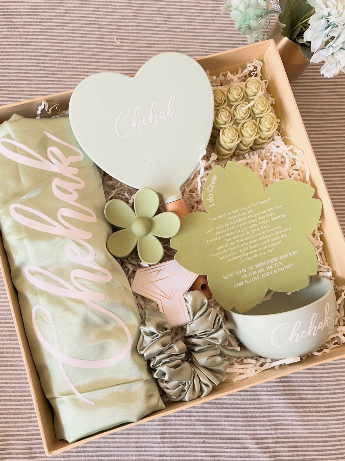 11 Bridal Shower Gift Basket Ideas for Every Bride-to-Be 9 Gift box with light green satin pillowcase, heart mirror, and beauty accessories.
