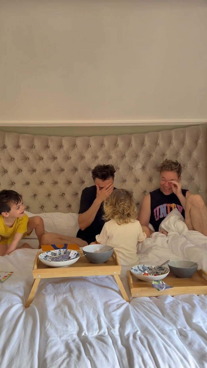9 Cheap Fathers Day Gifts with Handmade and Easy Ideas 1 Family serving breakfast on wooden trays to two men in a white bed