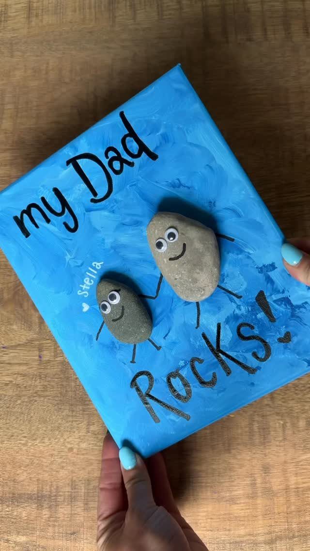 9 Cheap Fathers Day Gifts with Handmade and Easy Ideas 9 Handmade Father's Day canvas with painted rocks and the text my Dad Rocks!