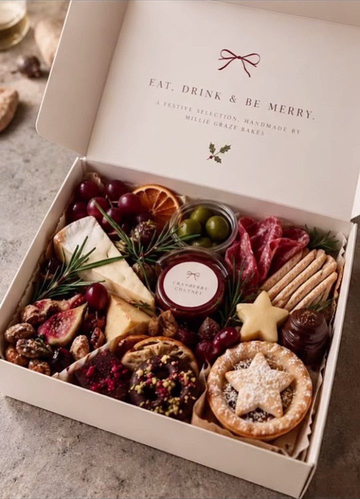 Christmas Food Basket Gift Ideas: 10 Options to Give 7 Charcuterie gift box with cheeses, meats, fruits, and crackers in a white box.