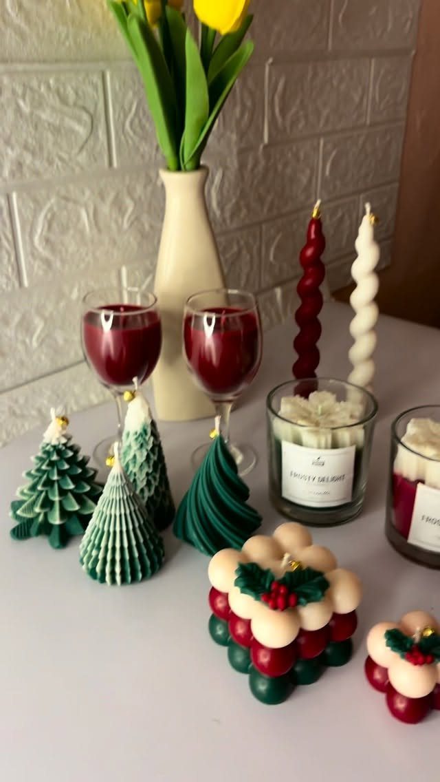 25 Christmas Gifts to Make at Home: Candles to Cookies 20 Handmade Christmas candles in tree and bubble shapes with red wine and tulips.