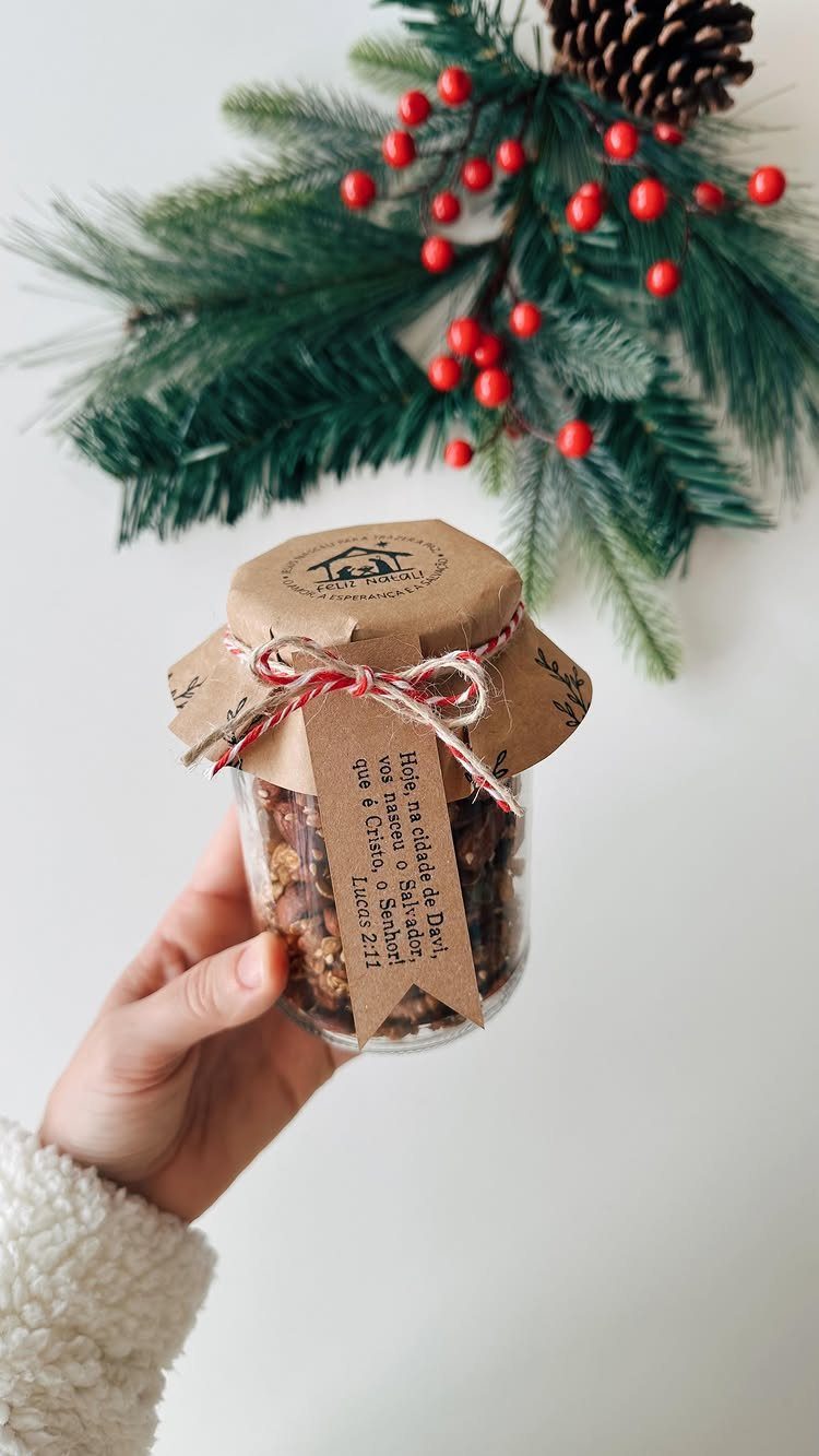 25 Christmas Gifts to Make at Home: Candles to Cookies 17 Granola in a glass jar with a brown paper lid and red twine.