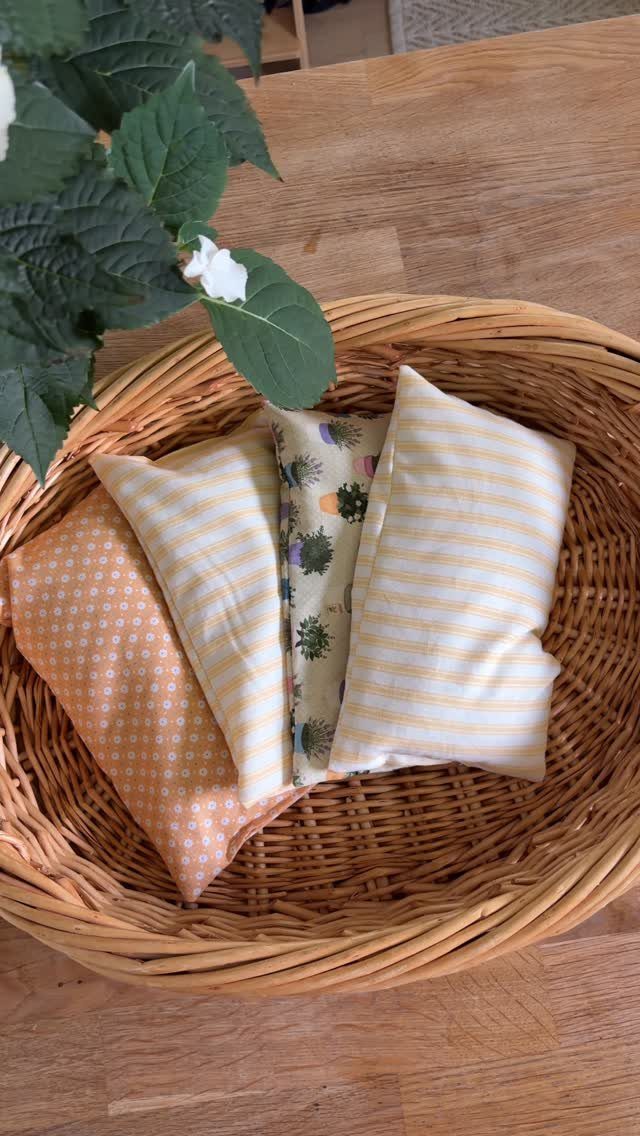 25 Christmas Gifts to Make at Home: Candles to Cookies 25 Handmade fabric pouches in a wicker basket on a wooden table.