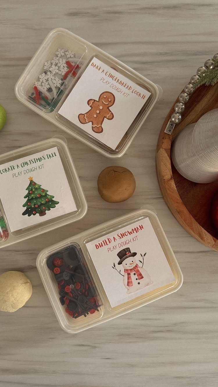 25 Christmas Gifts to Make at Home: Candles to Cookies 6 Three themed playdough kits in plastic containers with decorative pieces and cards.
