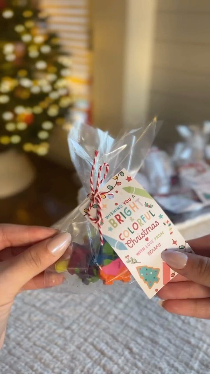 25 Christmas Gifts to Make at Home: Candles to Cookies 5 Colorful shaped crayons in a clear gift bag with a Christmas tag.