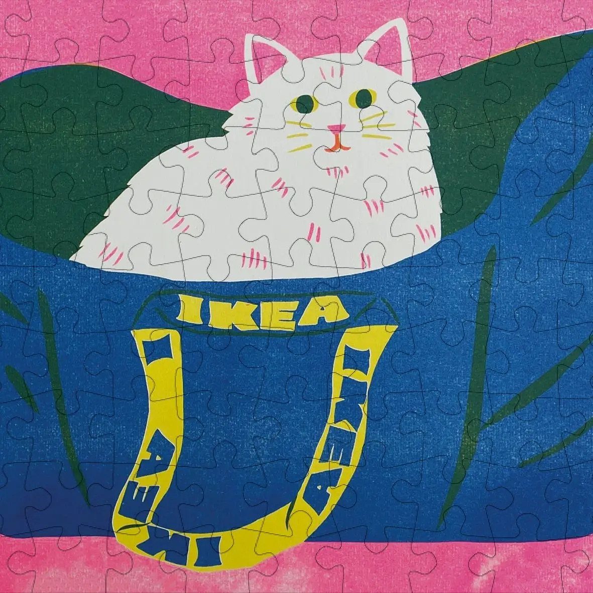 Christmas Stocking Gifts: 8 Small Ideas, Socks to Puzzles 7 Completed jigsaw puzzle of a white cat in a blue IKEA shopping bag.