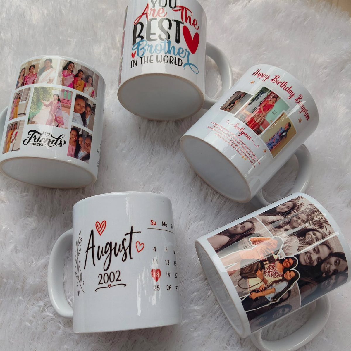 7 Coffee Gift Ideas for the Caffeine Fan on Your List 2 Five personalized white ceramic mugs with photos and text on white fluffy fur.