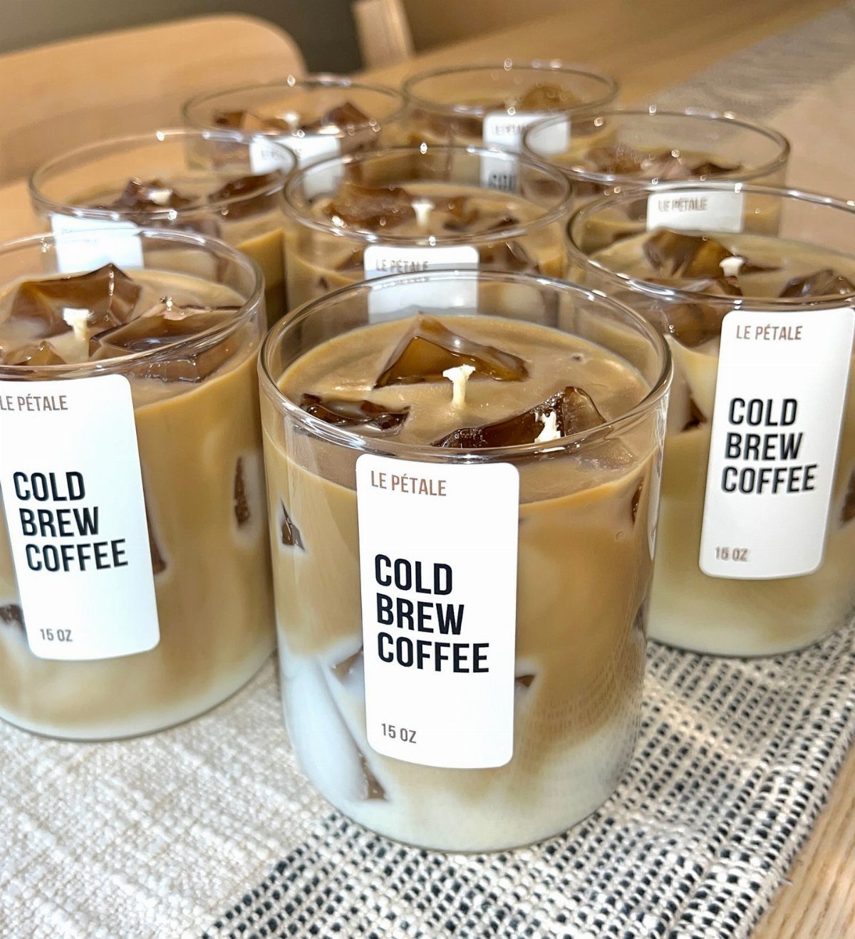 7 Coffee Gift Ideas for the Caffeine Fan on Your List 6 Coffee-scented candles in glass jars designed to look like iced cold brew coffee.