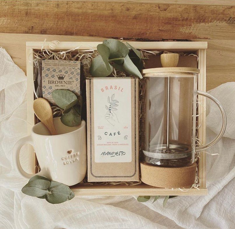 7 Coffee Gift Ideas for the Caffeine Fan on Your List 3 Coffee gift set with French press, coffee beans, white mug, and chocolate brownie.