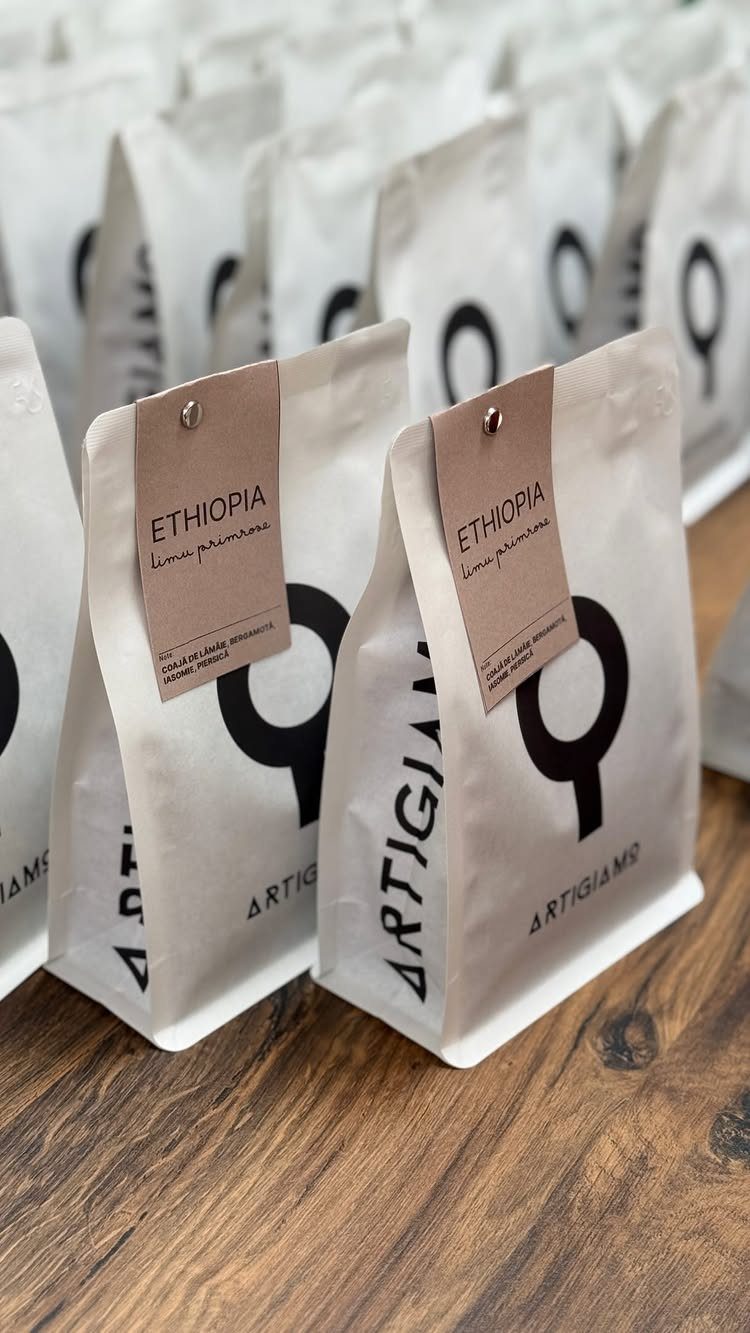 7 Coffee Gift Ideas for the Caffeine Fan on Your List 1 White coffee bean bags with Ethiopia labels sitting on a wooden table.