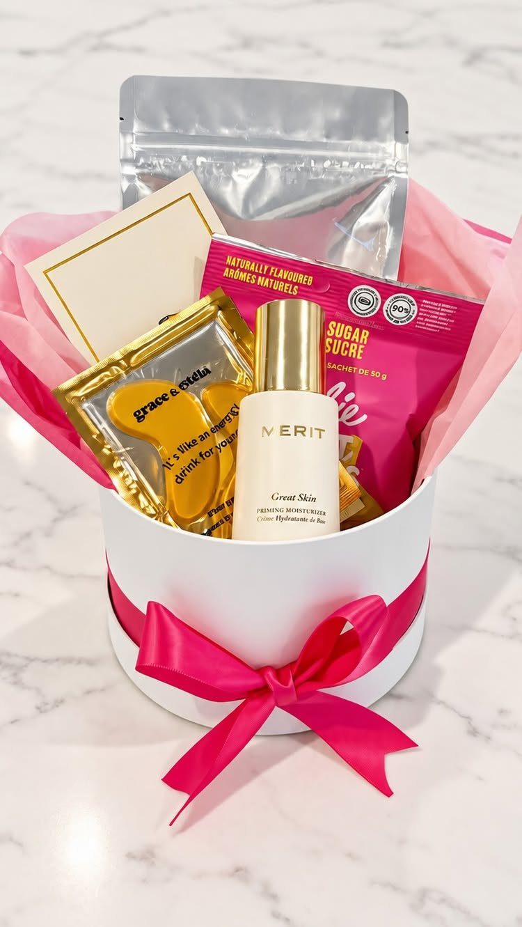 17 Creative Birthday Gifts for Friends and Family 1 White gift box with pink ribbon containing beauty products and wellness treats.