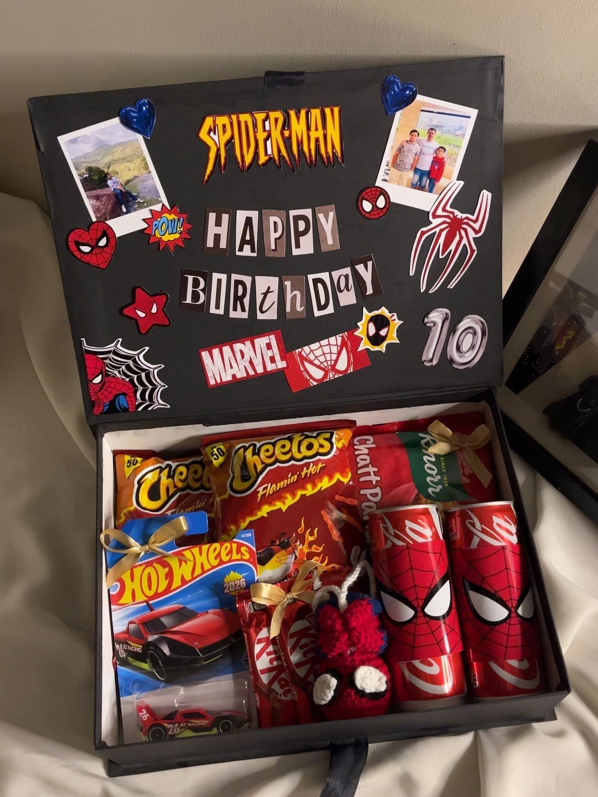 17 Creative Birthday Gifts for Friends and Family 9 Spider-Man themed birthday gift box filled with snacks, toys, and personalized decorations.