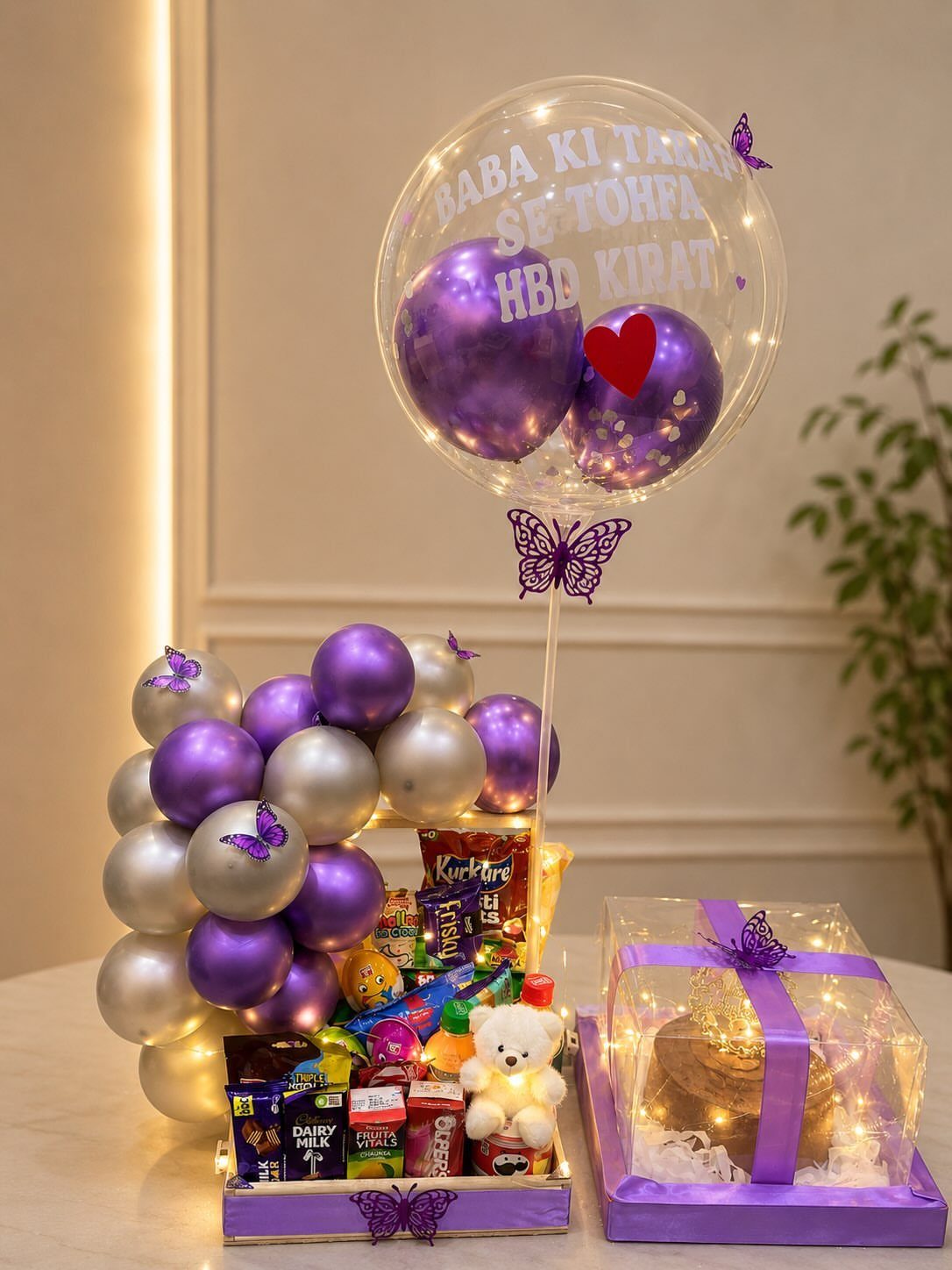 17 Creative Birthday Gifts for Friends and Family 5 Purple and silver gift set with balloons, chocolates, and a small teddy bear.