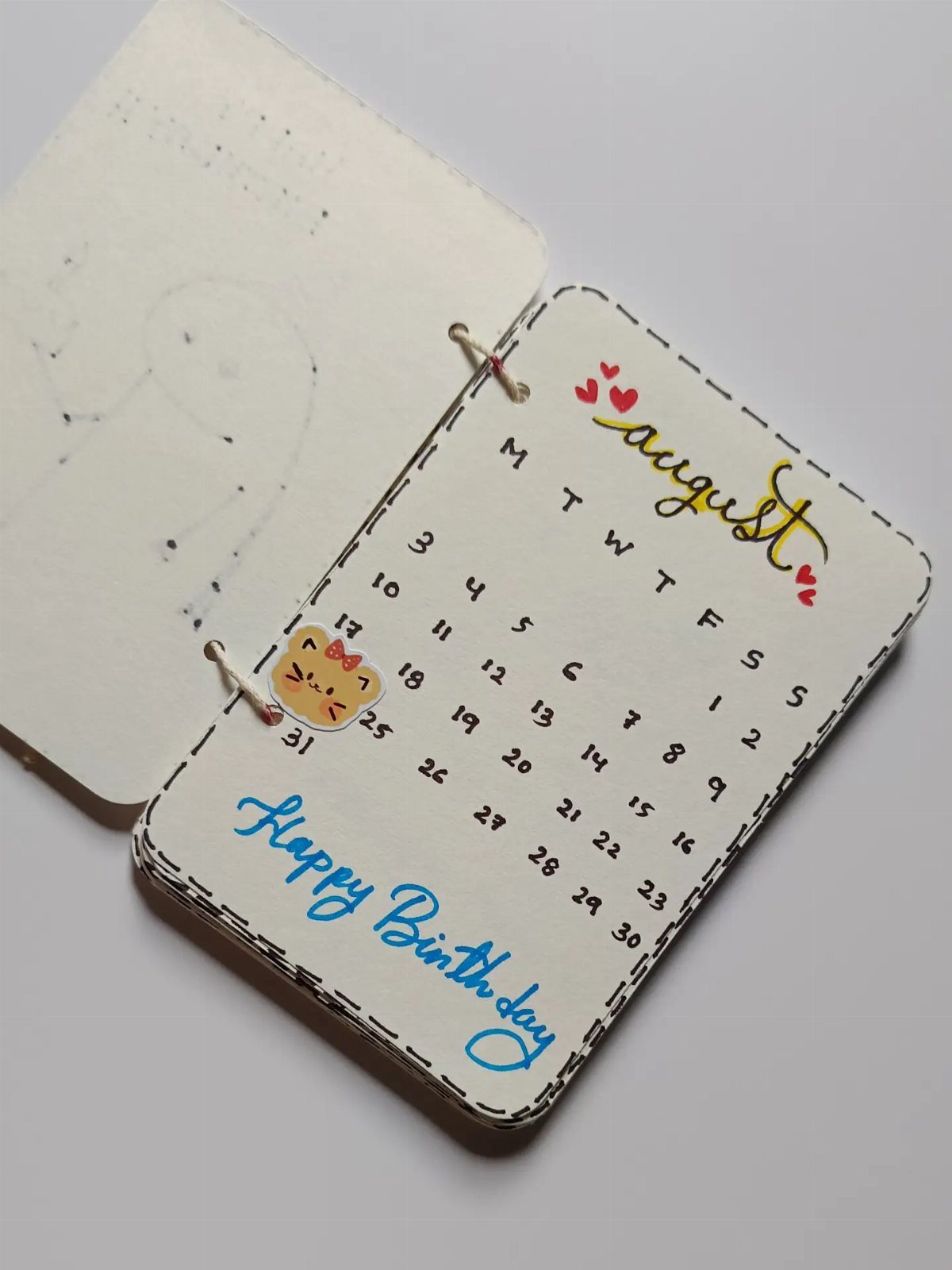 17 Creative Birthday Gifts for Friends and Family 12 Handmade August calendar with a cute cat and Happy Birthday message in blue.
