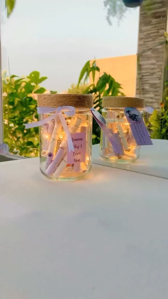 17 Creative Birthday Gifts for Friends and Family 14 Glass jars filled with rolled paper scrolls and fairy lights as creative gifts.