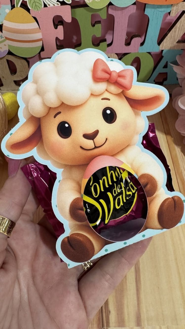 Cute sheep cutout holding a chocolate egg as an Easter gift idea.