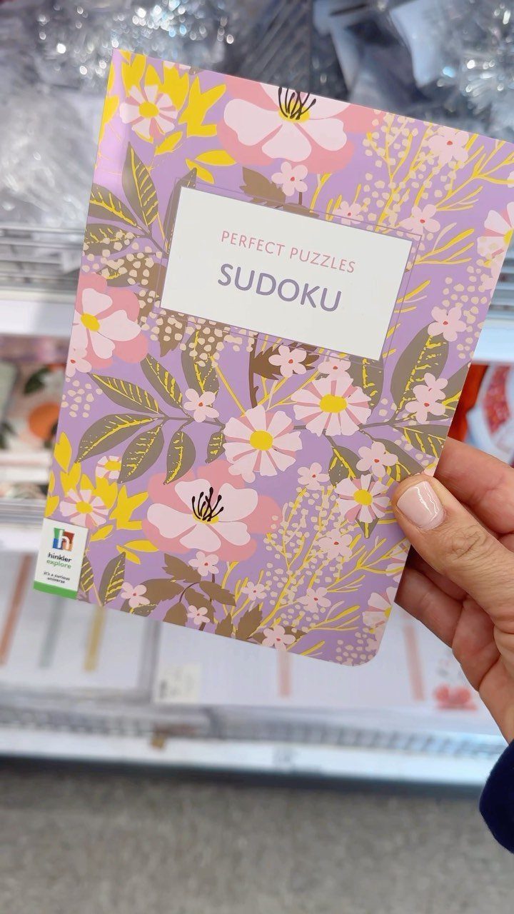 10 Easter Gifts for Young Adults They'll Actually Use 10 Sudoku puzzle book with floral cover held by a hand in a store