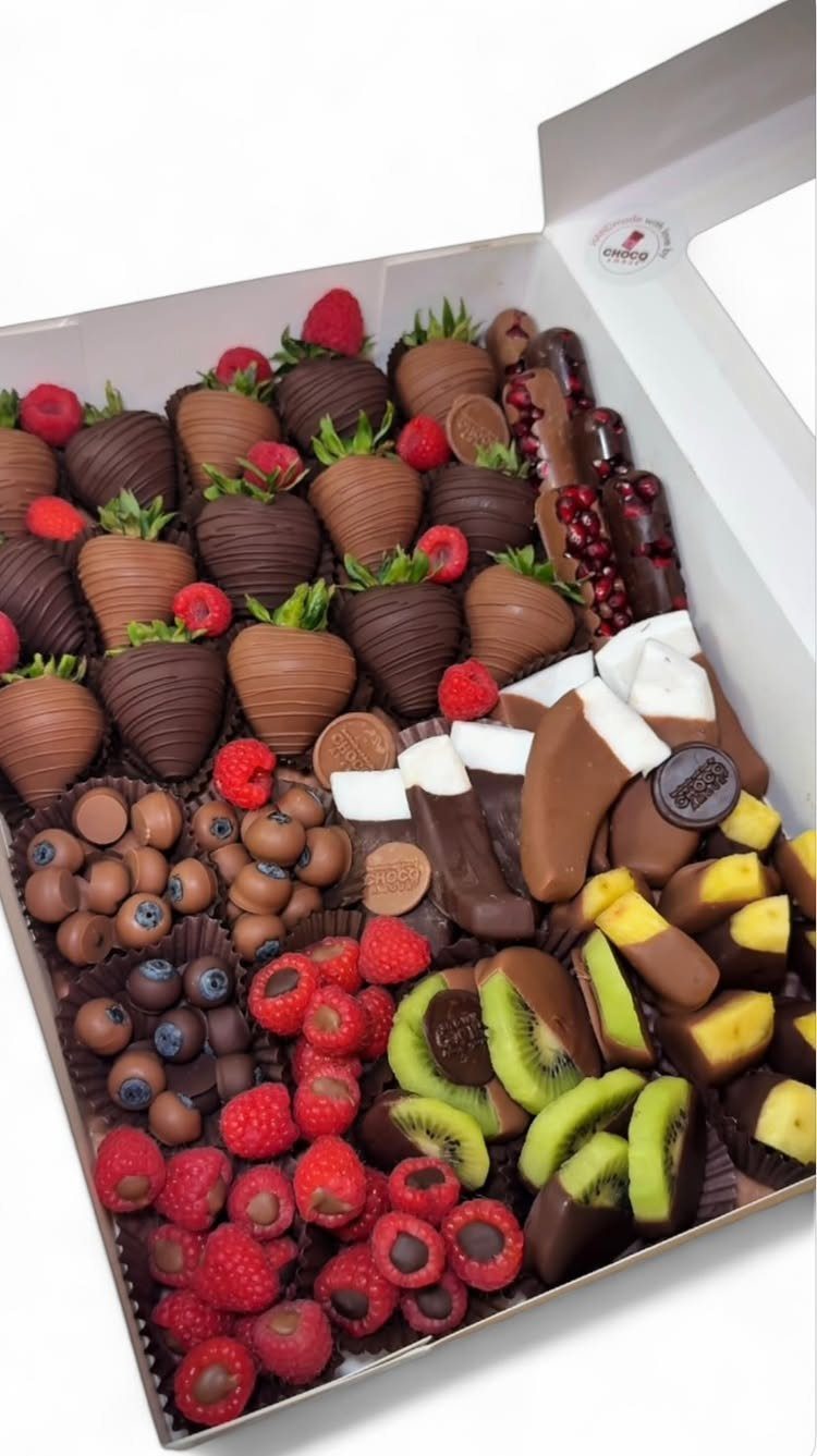 10 Easter Gifts for Young Adults They'll Actually Use 7 Chocolate-covered strawberries and assorted fruits arranged in a white gift box.