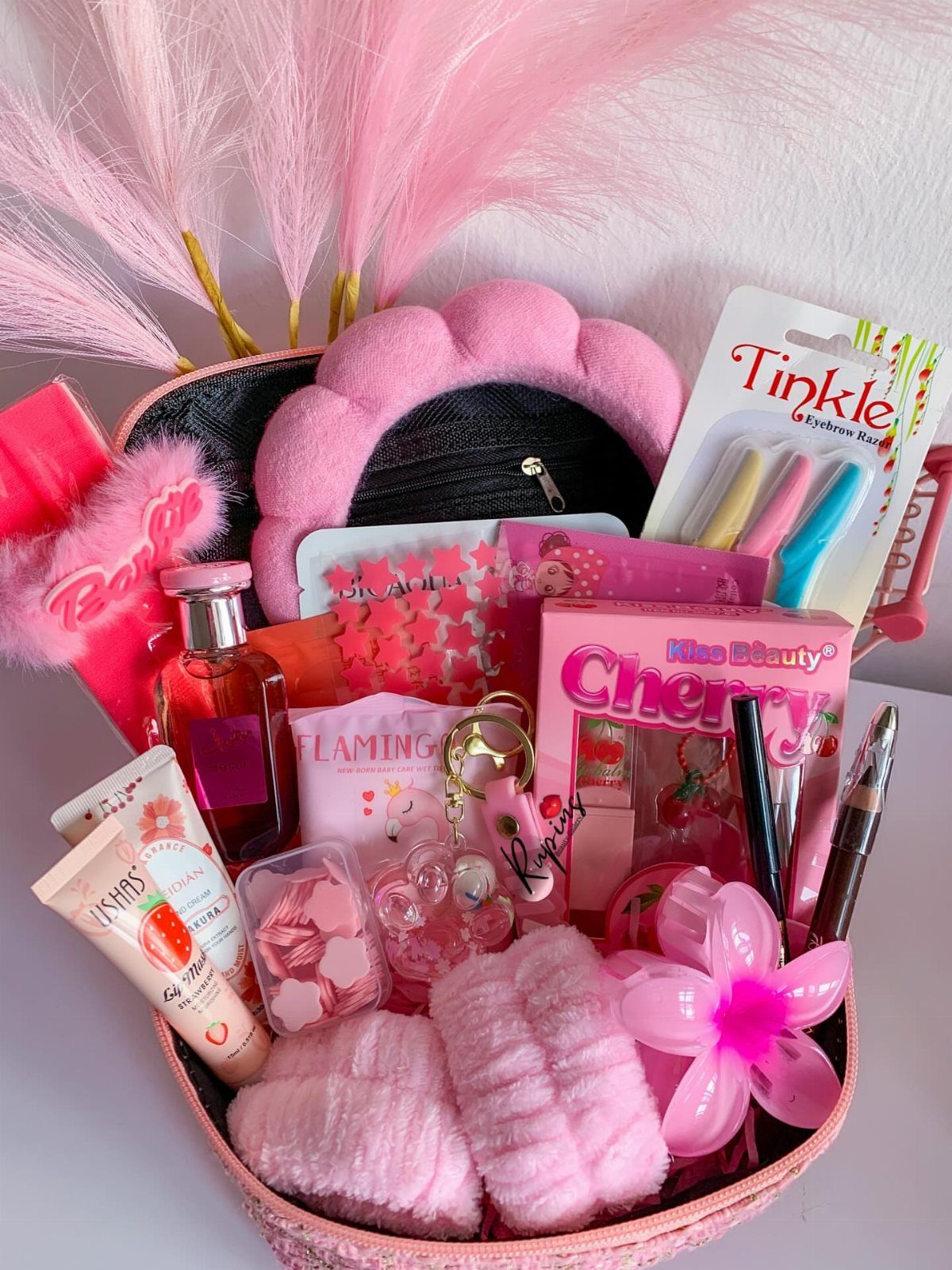 10 Easter Gifts for Young Adults They'll Actually Use 1 Pink gift basket filled with beauty products, skincare, and a plush headband.