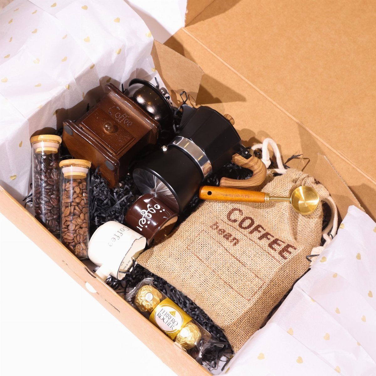 Coffee lover's gift bundle with grinder, French press, beans, and burlap bag in box.