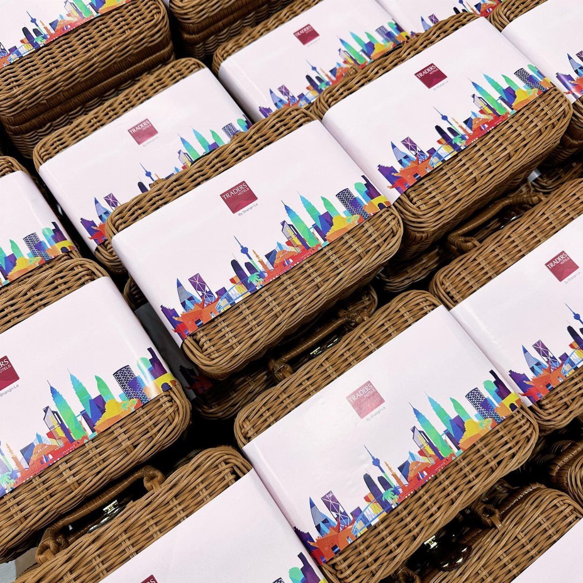 Woven wicker gift baskets with colorful city skyline cards on top.