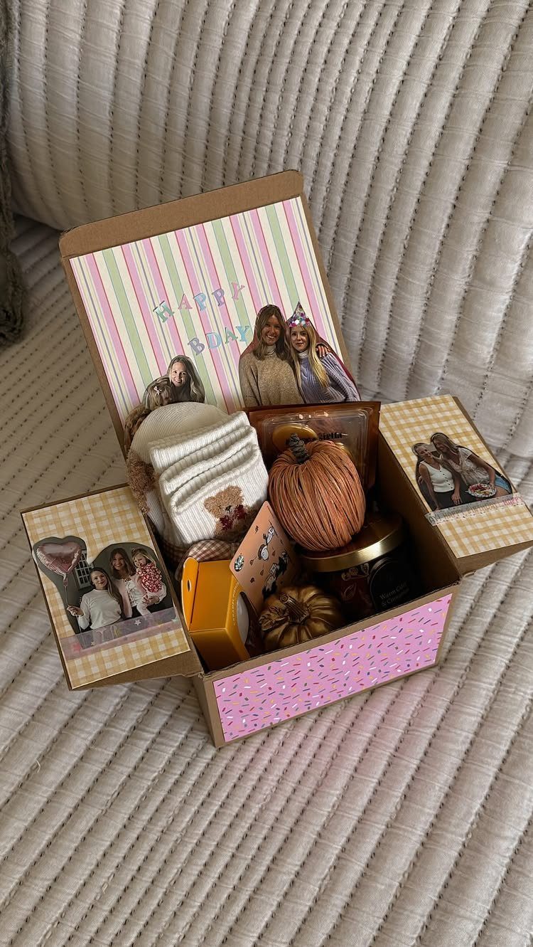 Personalized gift box with a white sweater, pumpkin, and photos of friends.