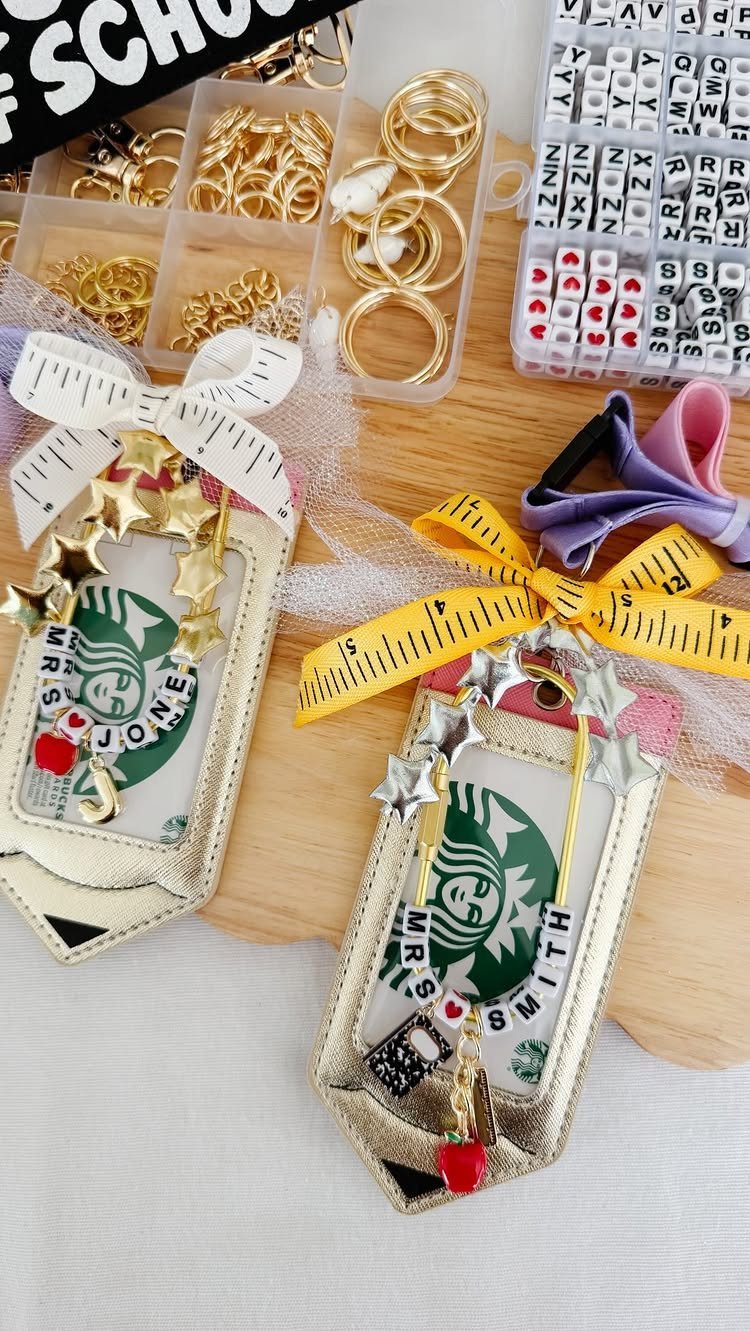 Personalized Starbucks card holders with beaded name straps and gold star charms.