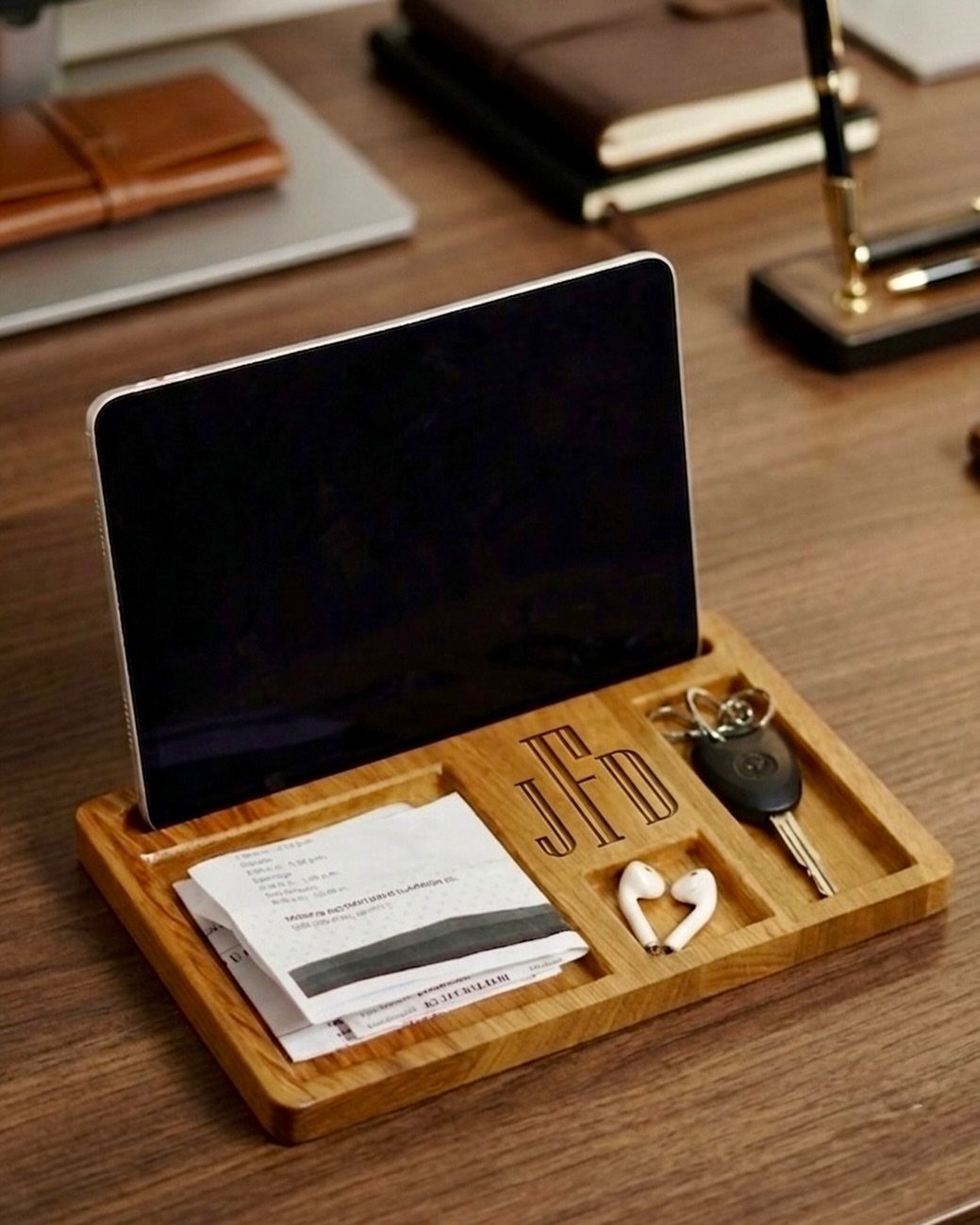 8 Father's Day Gift for Employees Ideas Dads Will Use 2 Wooden desk organizer with engraved initials holding a phone, keys, and earbuds.