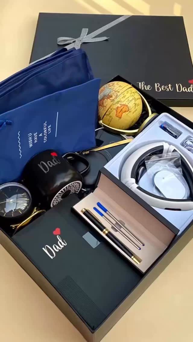 8 Father's Day Gift for Employees Ideas Dads Will Use 8 Gift box for Father's Day containing a Dad mug, notebook, pens, and headphones.
