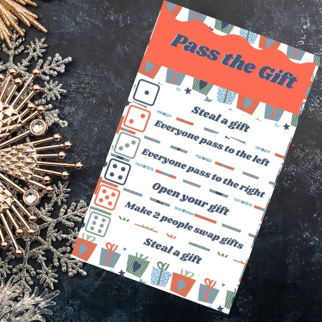 Pass the Gift game instruction sheet with dice rules and glittery snowflake decorations.