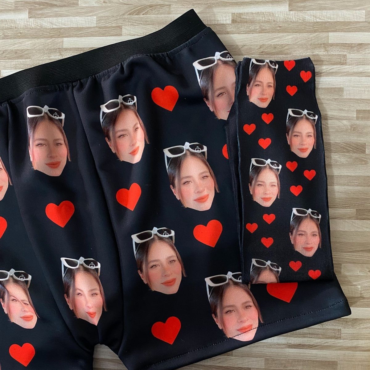 13 Funny Gag Gift Ideas for Birthdays and Office Parties 1 Black socks and boxers printed with a woman's face and red hearts.