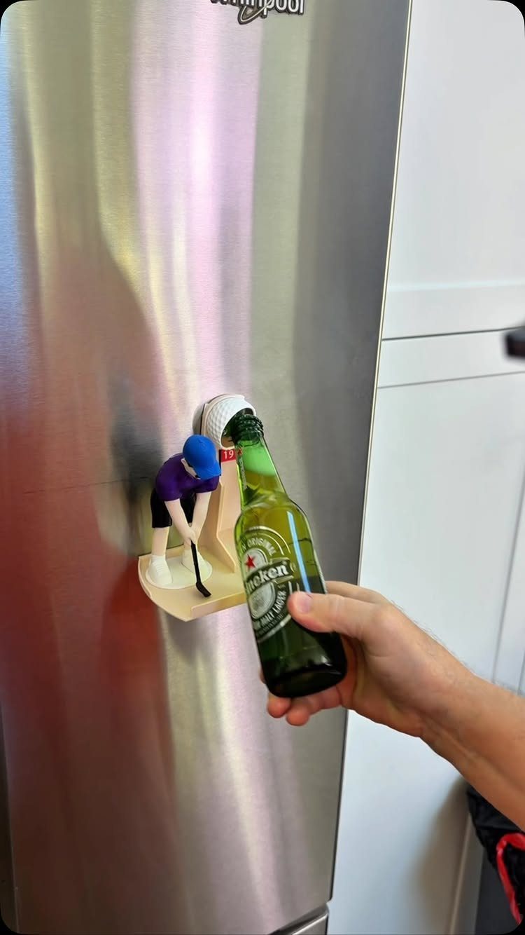 13 Funny Gag Gift Ideas for Birthdays and Office Parties 10 Hockey player figurine bottle opener mounted on a stainless steel refrigerator opening a beer