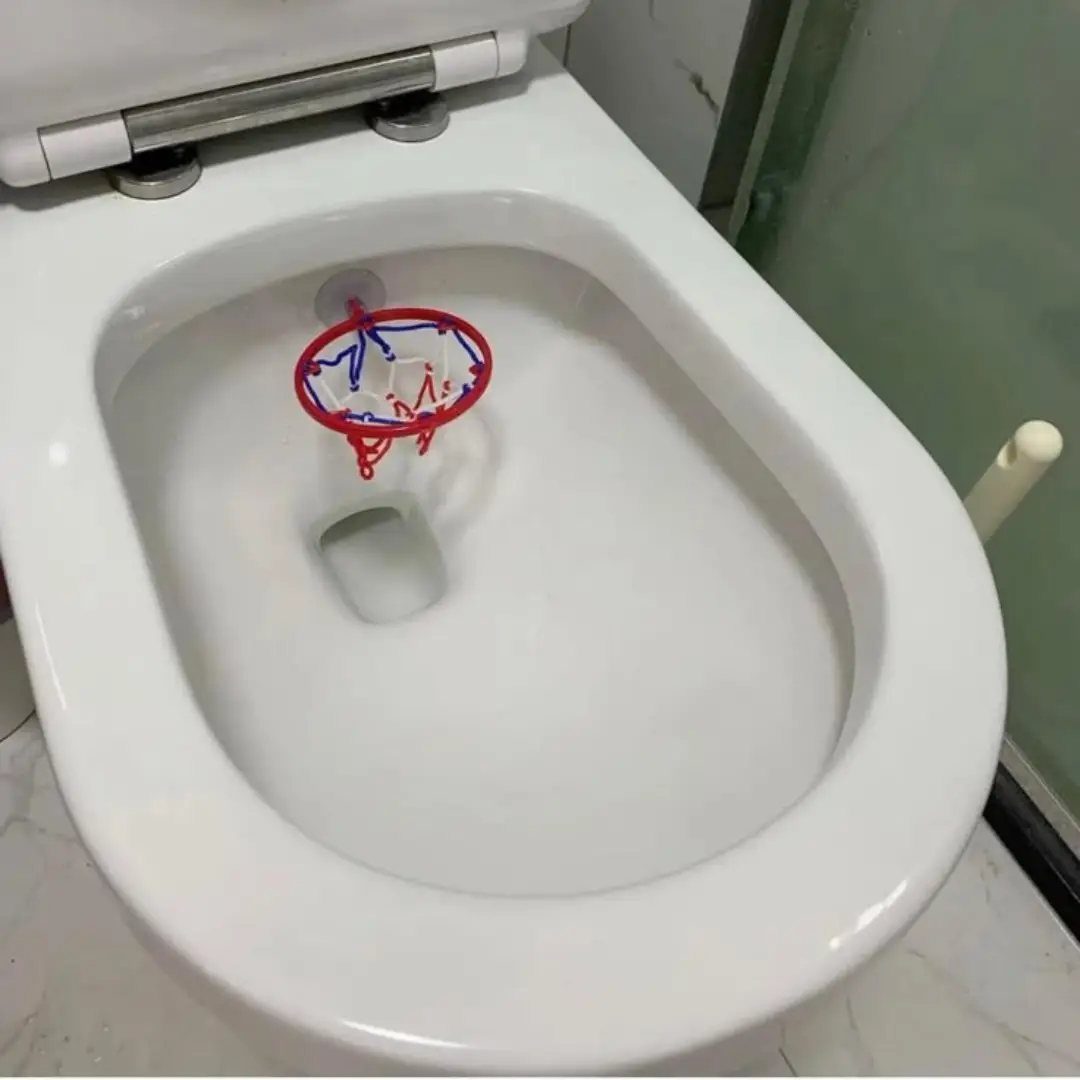 13 Funny Gag Gift Ideas for Birthdays and Office Parties 12 Small red basketball hoop attached to the rim of a white toilet bowl.