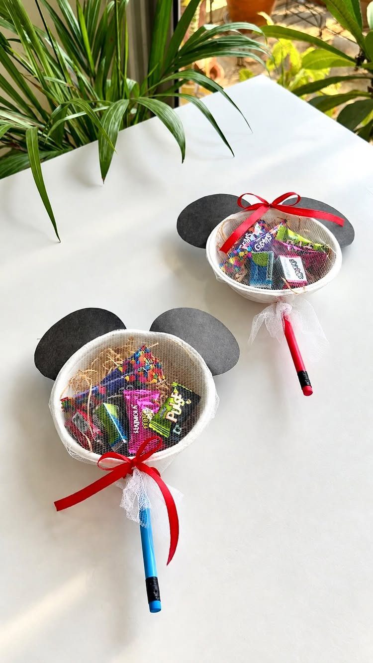 15 Gift Basket Alternative Ideas for Any Occasion 9 Mouse-shaped candy baskets with black ears, red ribbons, and attached colored pencils.