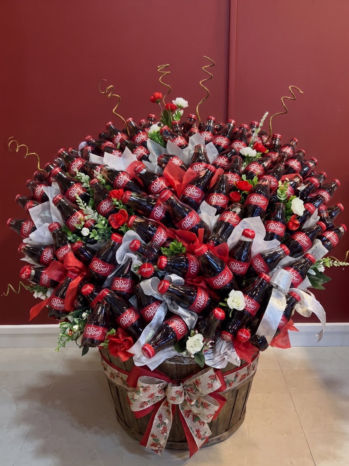 15 Gift Basket Alternative Ideas for Any Occasion 15 Wooden barrel filled with Coca-Cola bottles arranged as a floral-style gift bouquet.