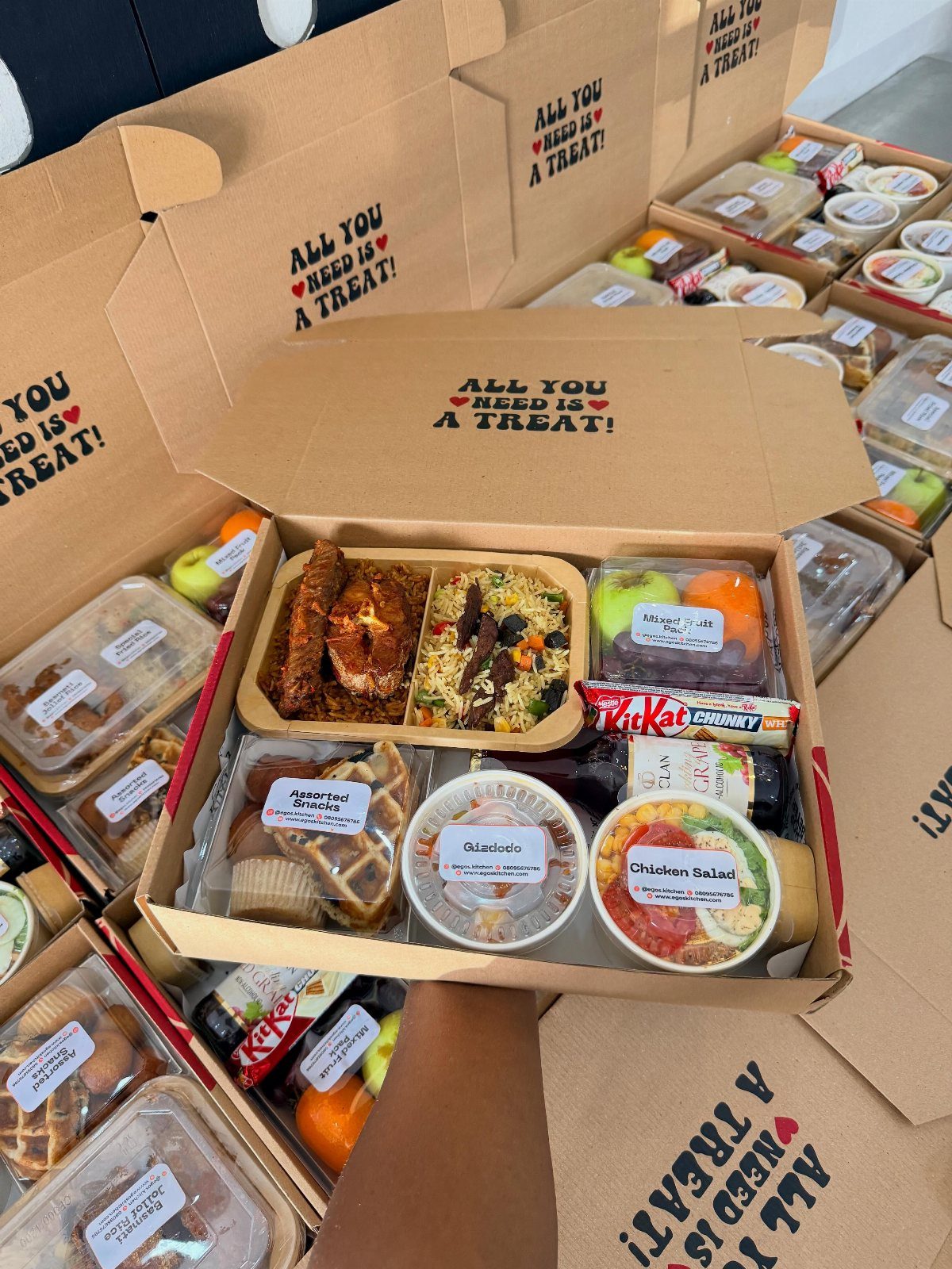 Gift Basket Design: 18 Ideas for Every Occasion 13 Cardboard gift boxes filled with savory meals, pastries, and drinks for comfort food.
