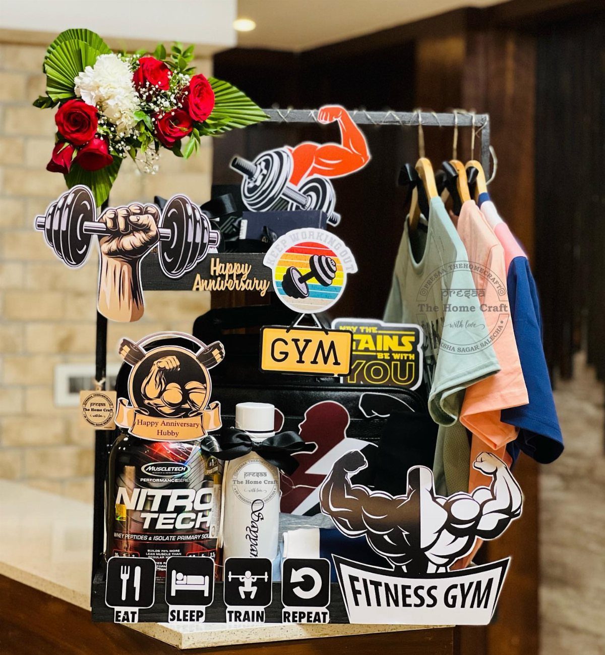 Gift Basket Design: 18 Ideas for Every Occasion 16 Fitness gift basket with protein powder, gym clothes, and muscular arm decorations.
