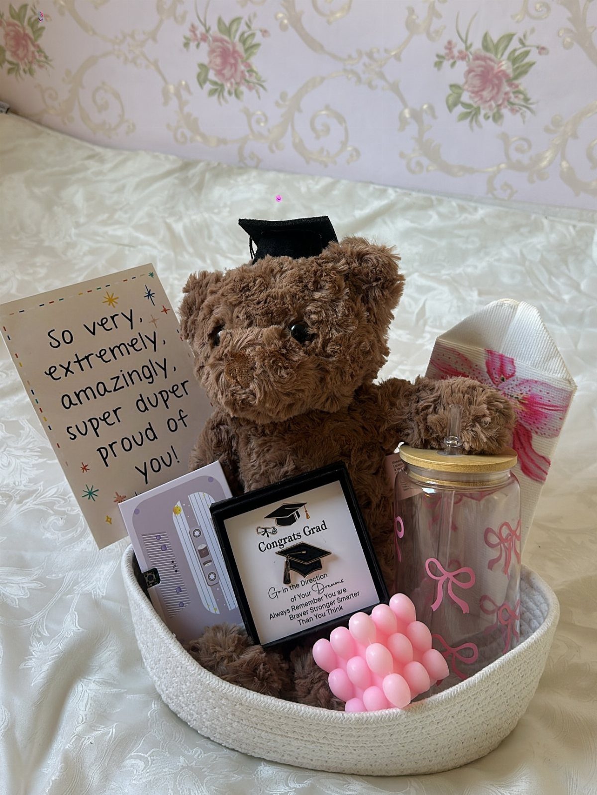 Gift Basket Design: 18 Ideas for Every Occasion 18 Graduation gift basket with a teddy bear in a cap and congratulatory cards.