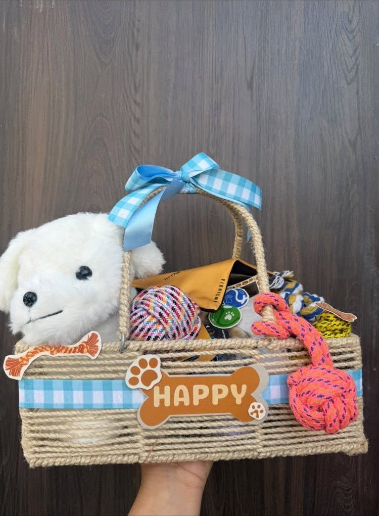 Gift Basket Design: 18 Ideas for Every Occasion 6 Woven gift basket filled with a plush dog and colorful pet rope toys.