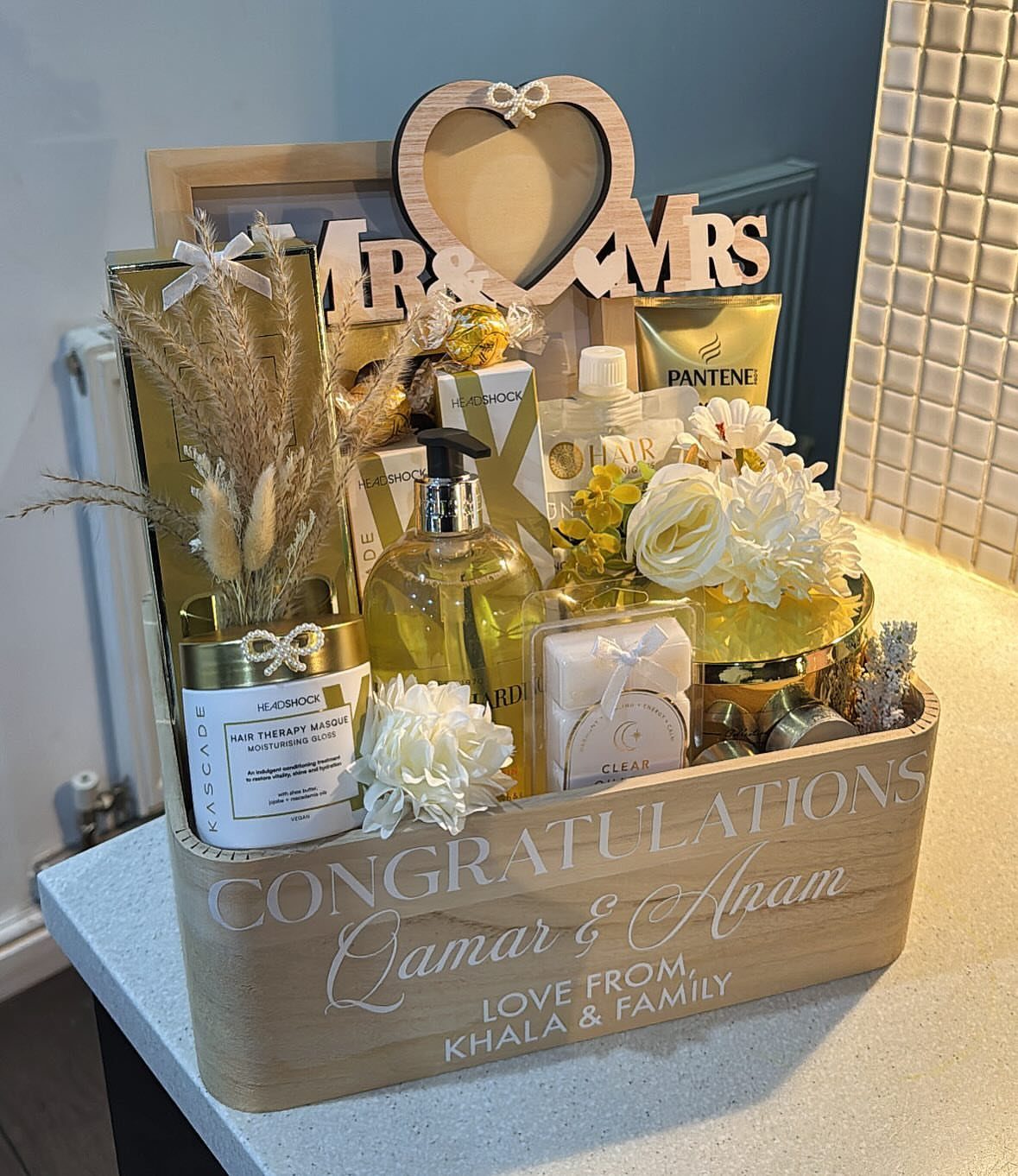 Gift Basket for Wedding: 5 Ideas for Couples and Guests 3 Wooden wedding gift crate filled with spa products, flowers, and Mr and Mrs sign.
