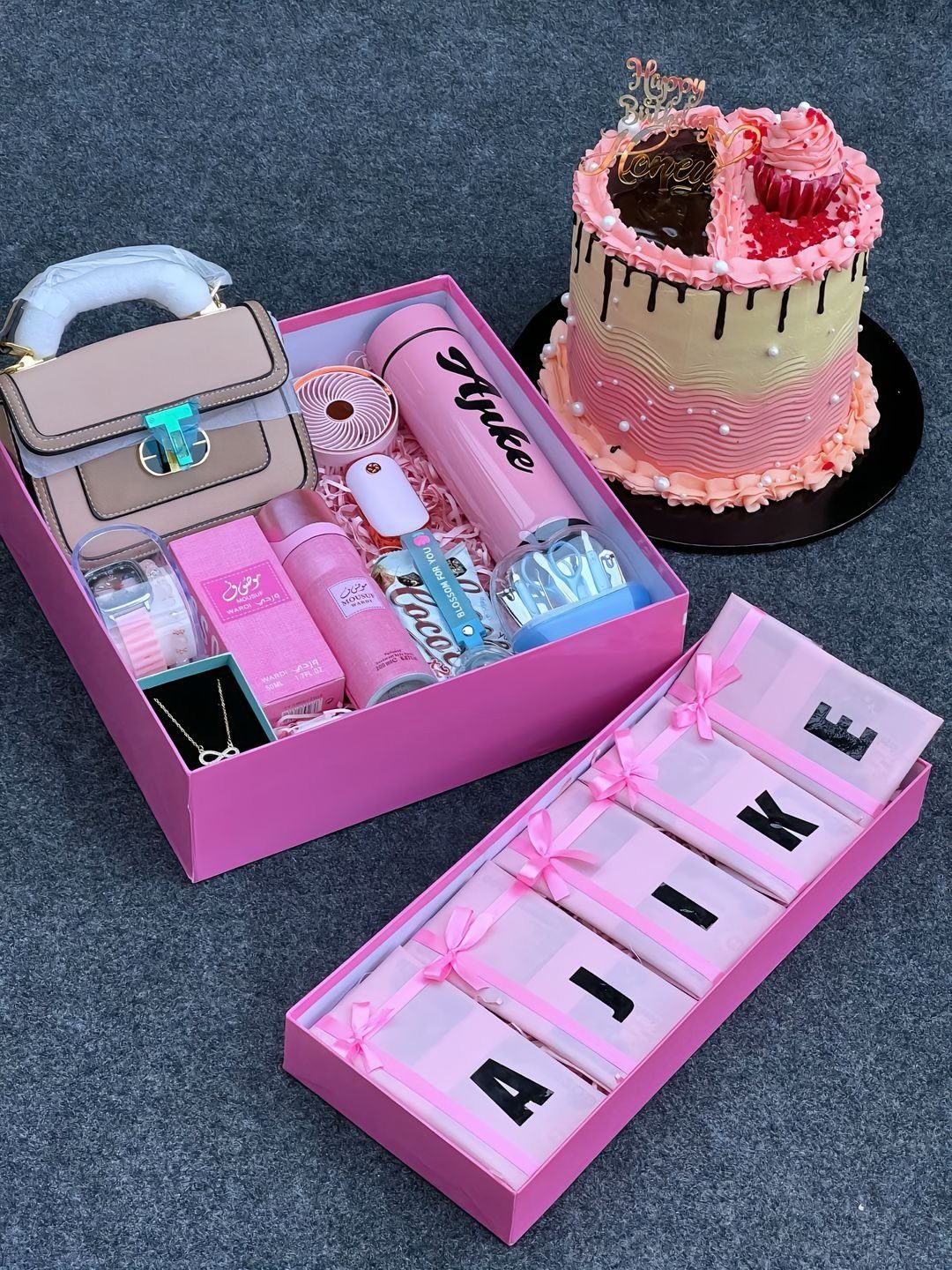 8 Gift Box Images: Red, Black, Pink, Blue and Clear 2 Pink gift boxes filled with beauty products and a decorated birthday cake.